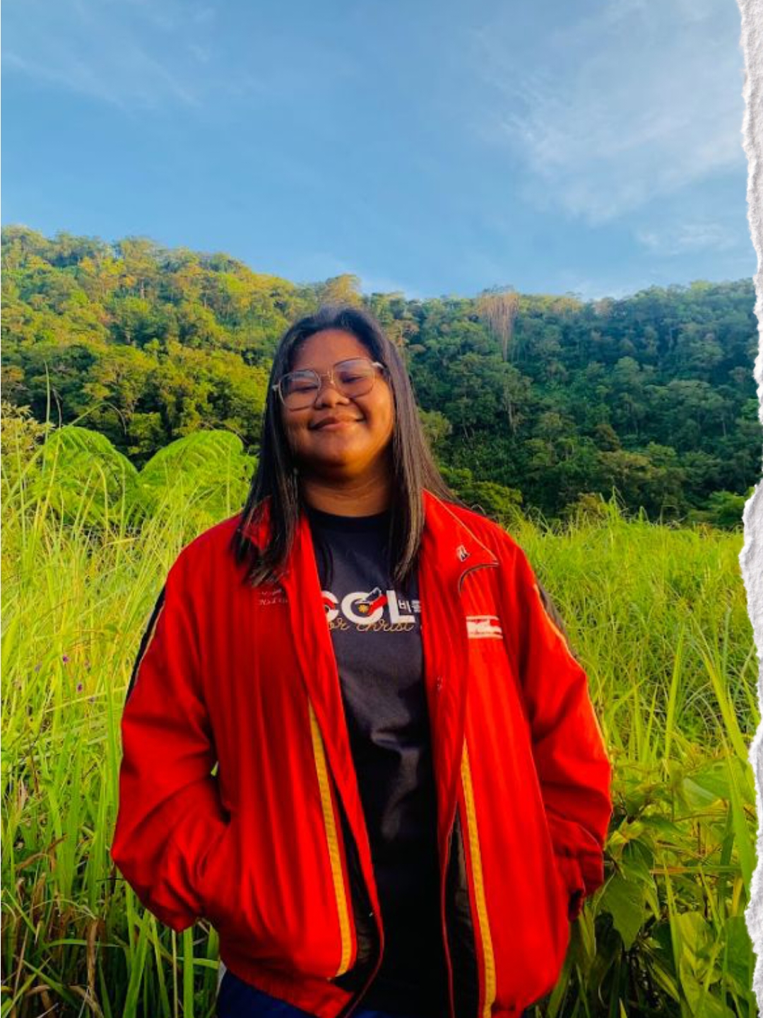 Florence Nicole Abesamis smiling outdoors in front of green hills